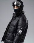 The Signature Huracan Men & Women's Black Puffer Jacket ski side angle head facing forwards