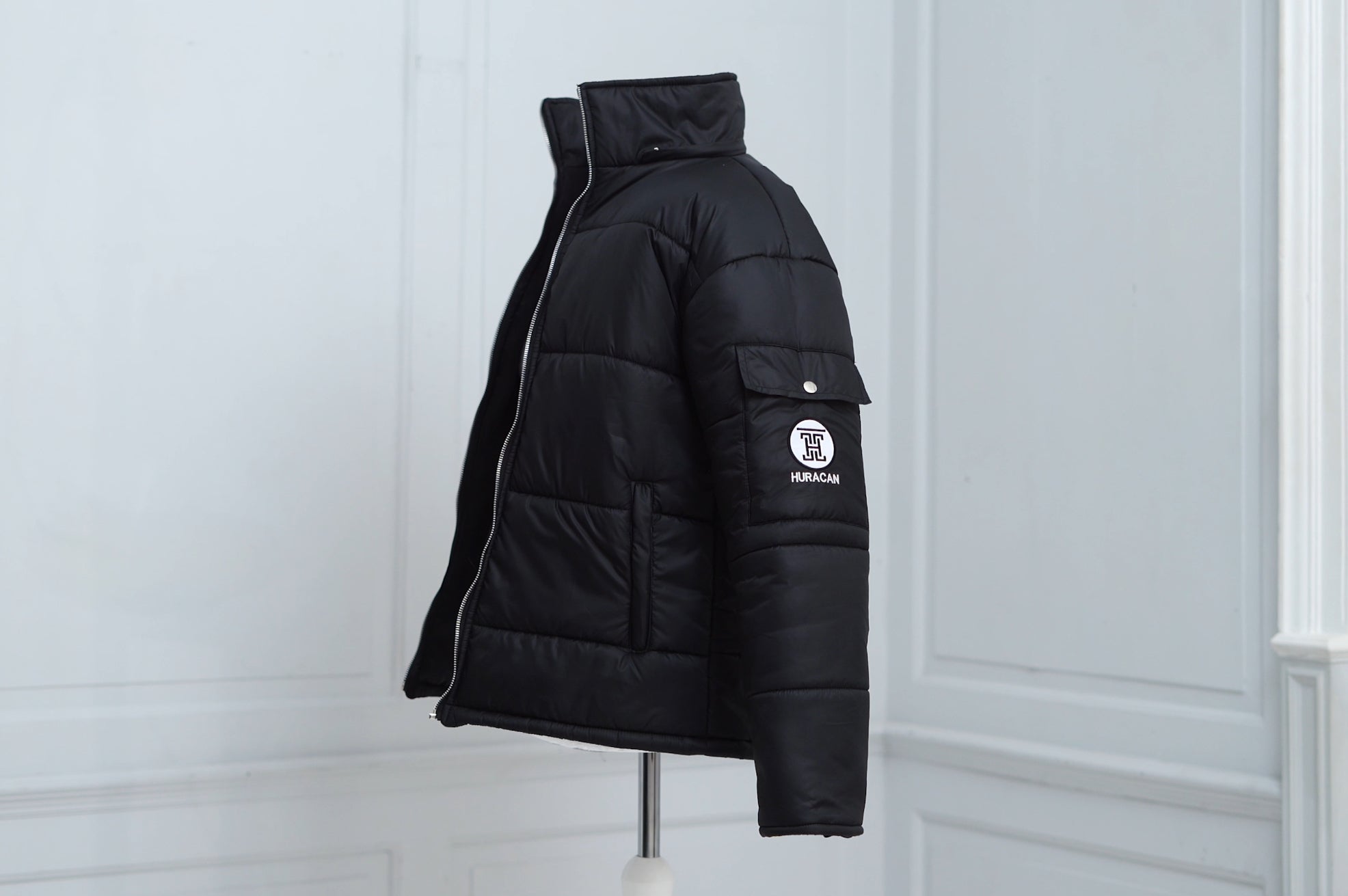 The Signature Huracan Men &amp; Women's Black Puffer Jacket Mannequin side angle