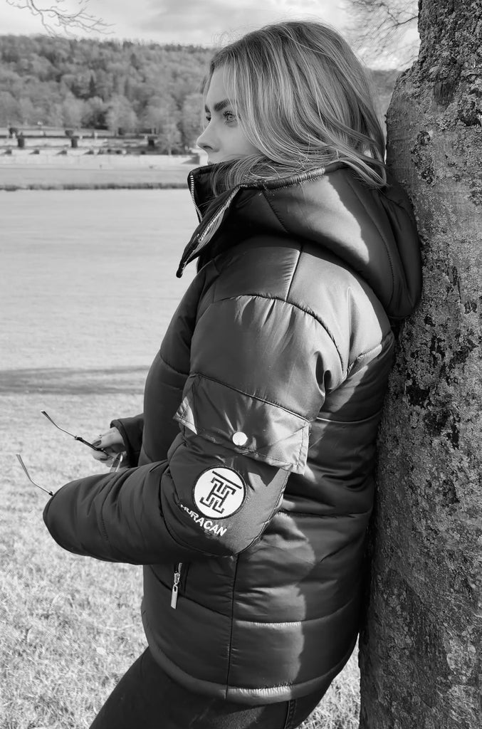 The Signature Huracan Men & Women's Black Puffer Jacket side video country girl smiling