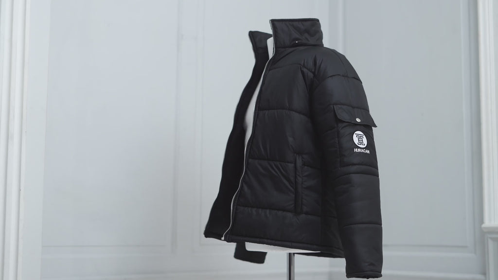 The Signature Huracan Men & Women's Black Puffer Jacket mannequin video side